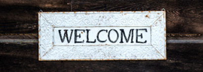 Schild mit dem Text &quot;Wecome&quot;